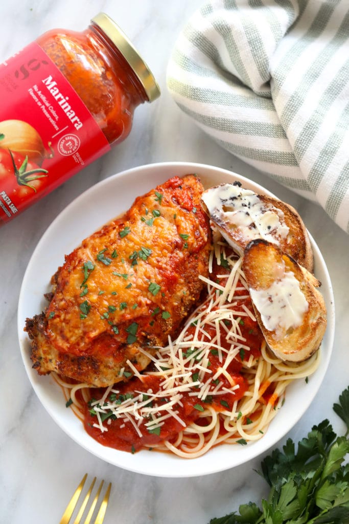 chicken parm on plate with marinara sauce