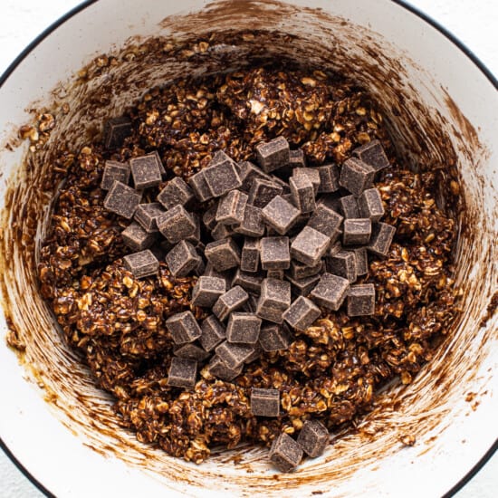 Chocolate granola in a bowl with chocolate chips.