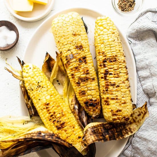 3 ears of corn on plate.