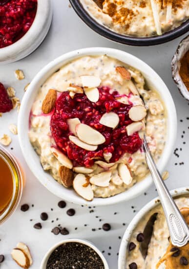 a bowl of oatmeal topped with fruit and nuts.