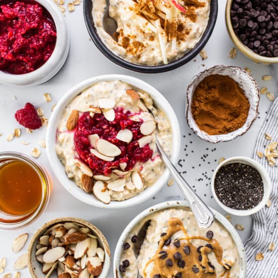 a table topped with bowls of oatmeal and fruit.