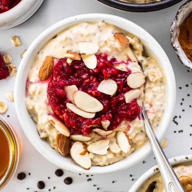 a bowl of oatmeal topped with fruit and nuts.