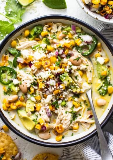 Mexican chicken soup in a bowl with tortilla chips.