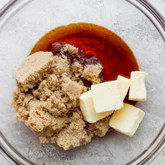 a bowl filled with butter and sugar.