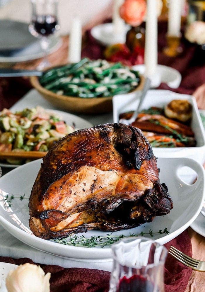 Thanksgiving dinner featuring a delicious Sous Vide Turkey alongside roasted vegetables.