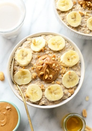 A bowl of overnight oats with peanut butter and banana slices.