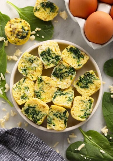 a plate with spinach and eggs on it.