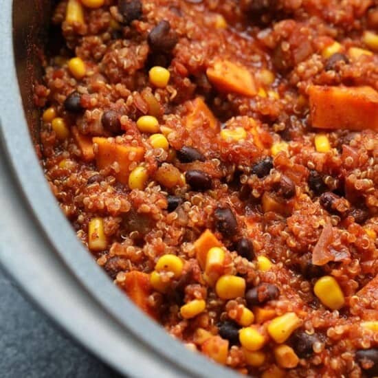 A slow cooker filled with Mexican quinoa after cooking.