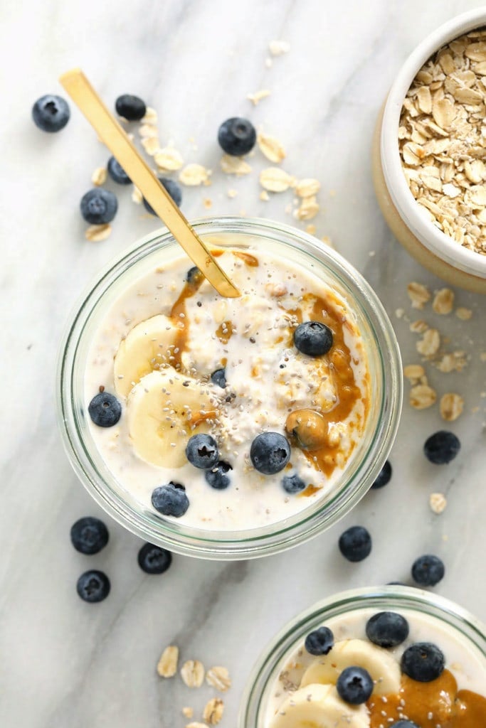 overnight oats in jar with blueberries on top.