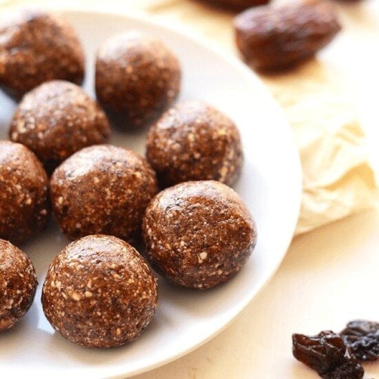 Cherry pie energy balls on a white plate.