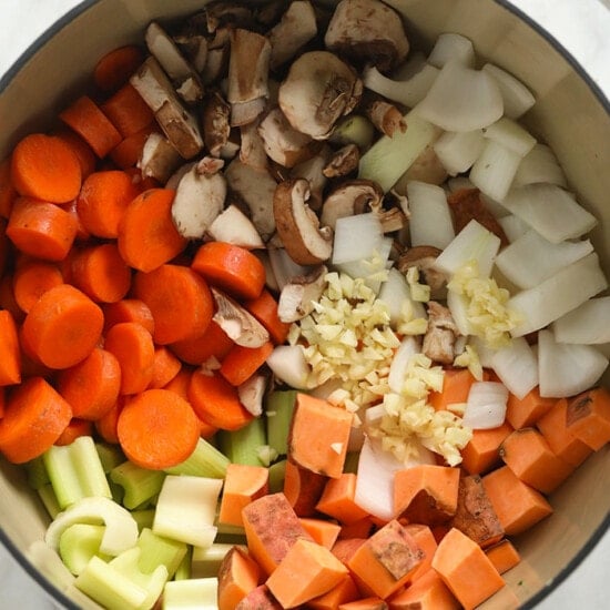 A white bowl filled with a savory Sweet Potato Lentil Stew.