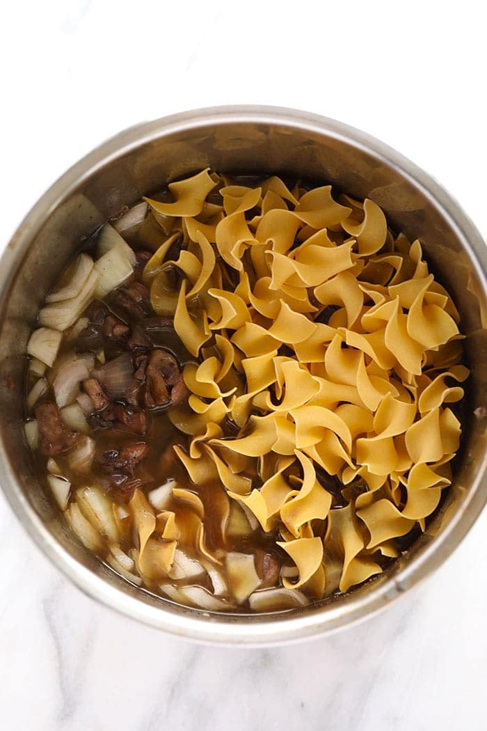 Instant pot beef stroganoff egg noodles ready to be cooked.