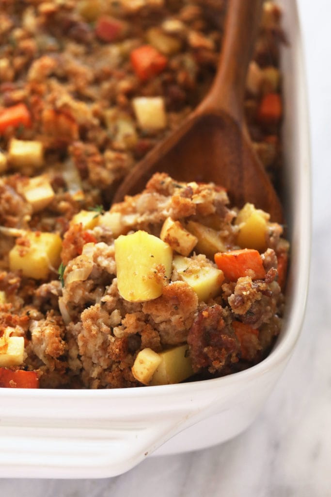 sausage stuffing on a wooden spoon ready to be served